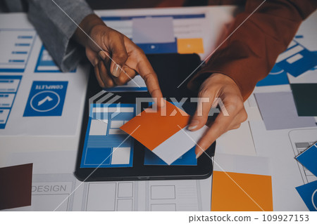 team of UI UX web designer are working together to develop mobile responsive websites. Mobile Mockup 109927153