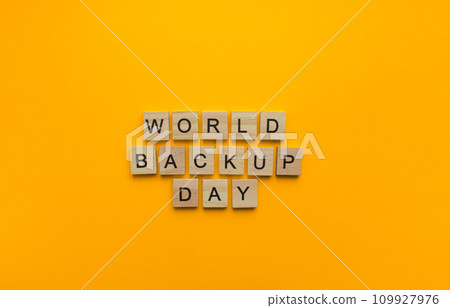 On March 31, World Backup Day, a minimalistic banner with an inscription in wooden letters 109927976