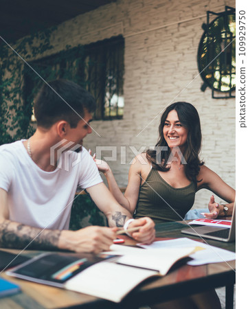 Young happy people studying together in terrace Young happy people studying together in terrace 109929750