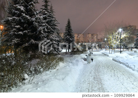 Winter cityscape with and snow-covered fir trees in Moscow, Russia Winter cityscape with and snow-covered fir trees in Moscow, Russia 109929864