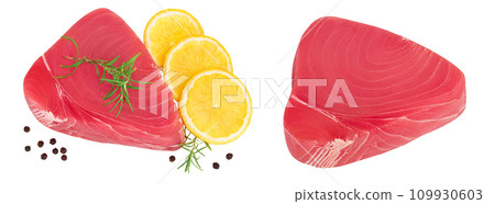 Fresh tuna fish fillet steak with rosemary, lemon and peppercorns isolated on white background . Top view. Flat lay 109930603