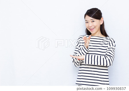 A woman saying thank you in sign language A woman saying thank you in sign language 109930837