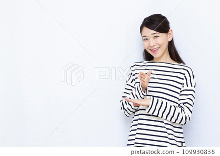 A woman saying thank you in sign language A woman saying thank you in sign language 109930838