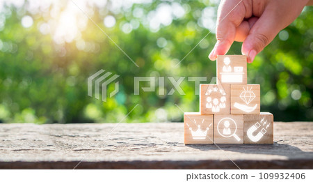 Employee Branding concept, Business hand holding wooden block with Employee Branding icon on virtual screen. Employee Branding concept, Business hand holding wooden block with Employee Branding icon on virtual screen. 109932406