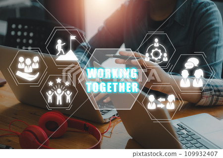 Working together concept, Business team using laptop computer on office desk with working together icon on virtual screen. Working together concept, Business team using laptop computer on office desk with working together icon on virtual screen. 109932407