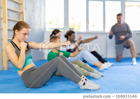 Family pupils performs exercises to strengthen press and improve accuracy of hands Family pupils performs exercises to strengthen press and improve accuracy of hands 109933149