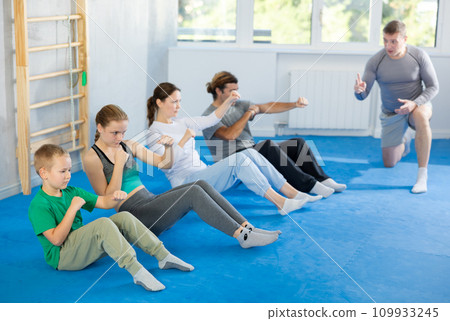 Family pupils performs exercises to strengthen press and improve accuracy of hands Family pupils performs exercises to strengthen press and improve accuracy of hands 109933245