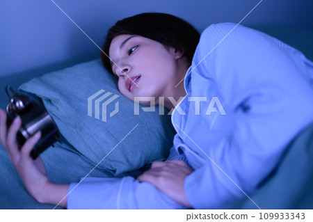 beautiful woman in pajamas 109933343