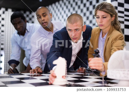 People trying together to find solution of conundrum in quest room People trying together to find solution of conundrum in quest room 109933753