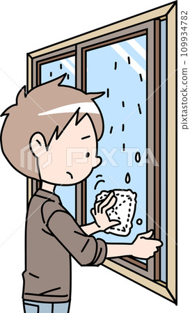 A man wiping a window with condensation A man wiping a window with condensation 109934782