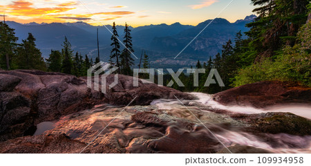 River down the waterfall in Canadian Mountain Landscape. Sunrise Sky. River down the waterfall in Canadian Mountain Landscape. Sunrise Sky. 109934958