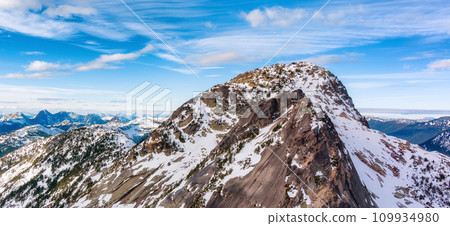 Rocky Mountain Peaks covered in Snow. Aerial Landscape Nature Background 109934980