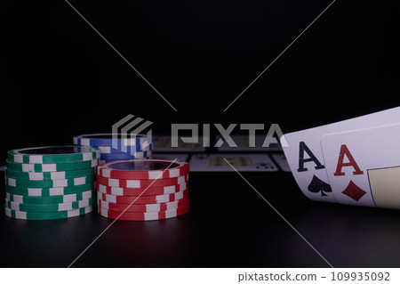 Dealer or croupier shuffles poker cards in a casino on the background of a table, chips. Concept of poker game. Playing for money, a big win, jackpot. Dealer or croupier shuffles poker cards in a casino on the background of a table, chips. Concept of poker game. Playing for money, a big win, jackpot. 109935092