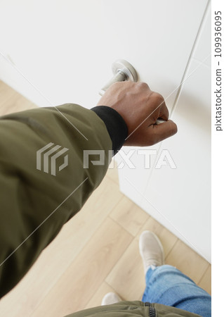 Man's Hand Opening door close up Man's Hand Opening door close up 109936095