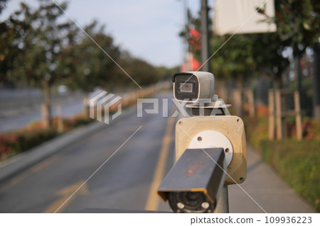 CCTV security camera operating outdoor  109936223