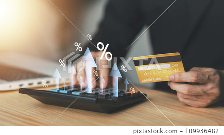Credit card debts. Businessman calculating with calculator. Businessman shopping online shopping and paying. Futuristic Digital money transfer, e-commerce banking concept. 109936482
