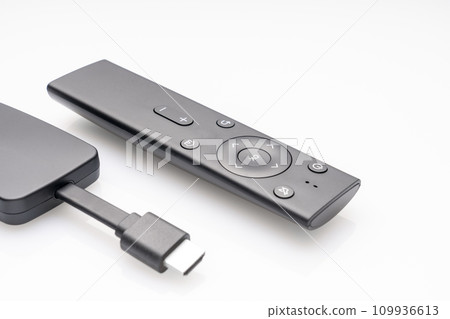 wireless internet TV set, set-top box and modern remote control, white background, selective focus, telecommunications equipment and technology concept wireless internet TV set, set-top box and modern remote control, white background, selective focus, telecommunications equipment and technology concept 109936613