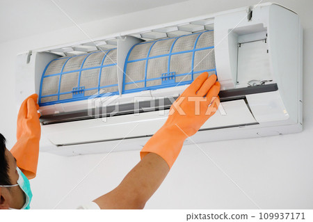 Asian man cleaning air conditioner dirty filter Asian man cleaning air conditioner dirty filter 109937171