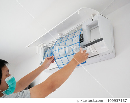 man hand hold air conditioner filter cleaning concept 109937187