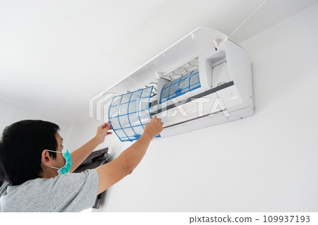 man hand hold air conditioner filter cleaning concept 109937193