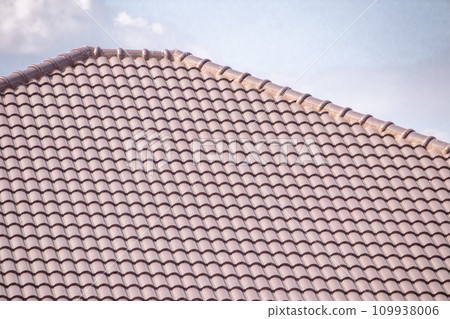 Ceramic roof tiles on the house with blue sky 109938006
