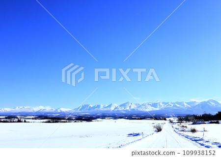 Hokkaido's winter land and snowy roads with blue skies Hokkaido's winter land and snowy roads with blue skies 109938152