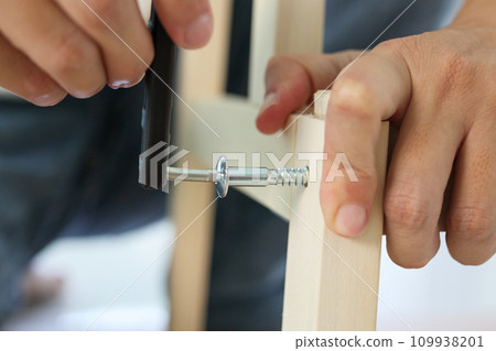 Assembly wooden furniture at home using screw allen 109938201
