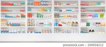 Empty wood counter top with pharmacy drugstore shelves blur pharmaceutical medicine product background Empty wood counter top with pharmacy drugstore shelves blur pharmaceutical medicine product background 109938212