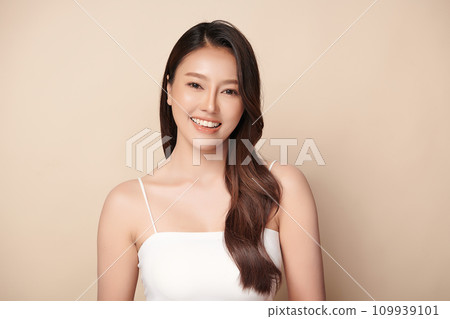 Beautiful young asian woman with clean fresh skin on beige background, Face care, Facial treatment, Cosmetology, beauty and spa, Asian women portrait. 109939101