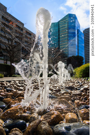 The momentary shape of water gushing out of a fountain 109940441