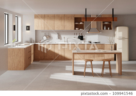 A bright beige-toned kitchen interior with sunlight coming through the window. A bright beige-toned kitchen interior with sunlight coming through the window. 109941546