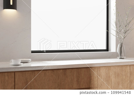 A bright beige-toned kitchen interior with sunlight coming through the window. 109941548