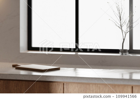 A bright beige-toned kitchen interior with sunlight coming through the window. A bright beige-toned kitchen interior with sunlight coming through the window. 109941566