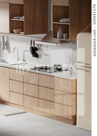 A bright beige-toned kitchen interior with sunlight coming through the window. 109941579