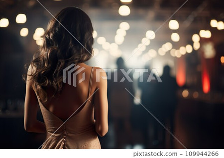 A woman in a dress at a party venue09 A woman in a dress at a party venue09 109944266