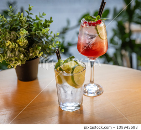 Glass of red currant and lemon soda drink Glass of red currant and lemon soda drink 109945698