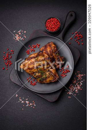 Delicious juicy beef or chicken steak with salt, spices and herbs Delicious juicy beef or chicken steak with salt, spices and herbs 109947026