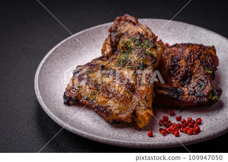 Delicious juicy beef or chicken steak with salt, spices and herbs Delicious juicy beef or chicken steak with salt, spices and herbs 109947050