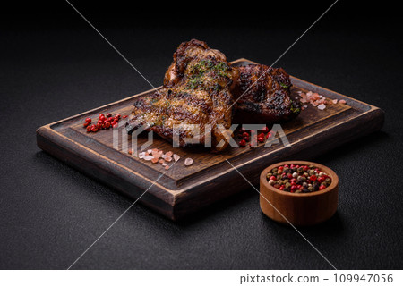 Delicious juicy beef or chicken steak with salt, spices and herbs 109947056