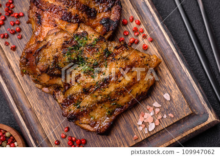 Delicious juicy beef or chicken steak with salt, spices and herbs Delicious juicy beef or chicken steak with salt, spices and herbs 109947062