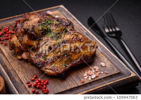Delicious juicy beef or chicken steak with salt, spices and herbs Delicious juicy beef or chicken steak with salt, spices and herbs 109947063