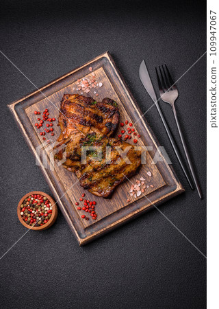 Delicious juicy beef or chicken steak with salt, spices and herbs Delicious juicy beef or chicken steak with salt, spices and herbs 109947067