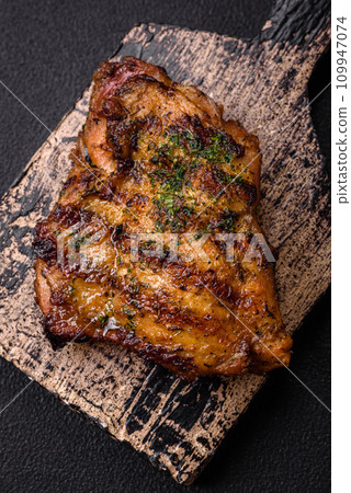 Delicious juicy beef or chicken steak with salt, spices and herbs Delicious juicy beef or chicken steak with salt, spices and herbs 109947074