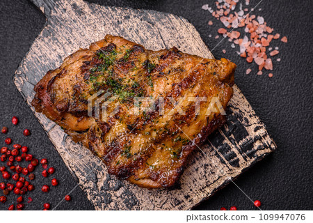 Delicious juicy beef or chicken steak with salt, spices and herbs Delicious juicy beef or chicken steak with salt, spices and herbs 109947076