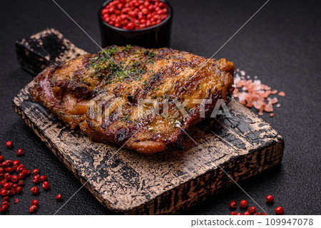 Delicious juicy beef or chicken steak with salt, spices and herbs Delicious juicy beef or chicken steak with salt, spices and herbs 109947078