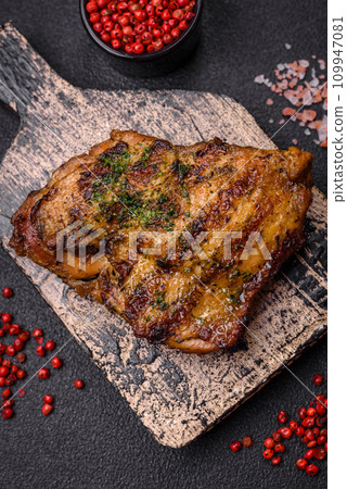 Delicious juicy beef or chicken steak with salt, spices and herbs Delicious juicy beef or chicken steak with salt, spices and herbs 109947081
