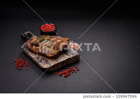 Delicious juicy beef or chicken steak with salt, spices and herbs Delicious juicy beef or chicken steak with salt, spices and herbs 109947084