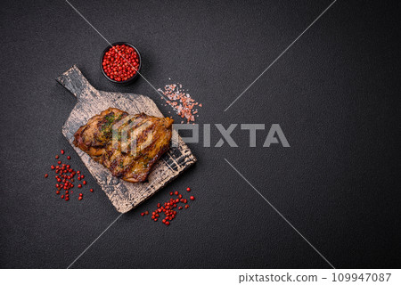 Delicious juicy beef or chicken steak with salt, spices and herbs Delicious juicy beef or chicken steak with salt, spices and herbs 109947087