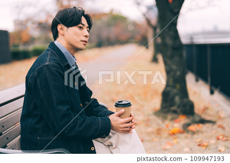 man drinking coffee by the river man drinking coffee by the river 109947193