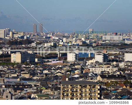 A cityscape along the river bathed in the morning sun 109948866